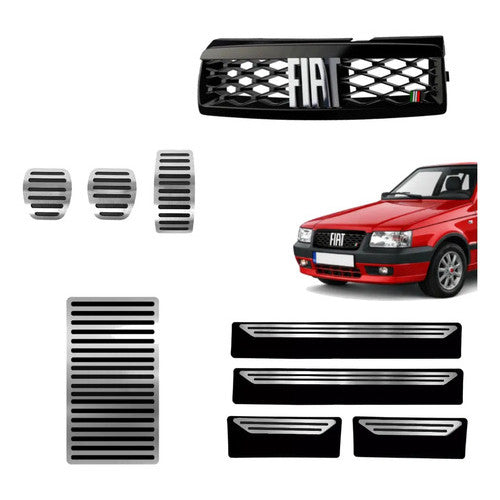 Kit Grade Preta Com Emblema Cromado e Pedaleira Lisa Descanso Liso e Soleiras Lisas em Inox Fiat Uno Mille 05 a 13